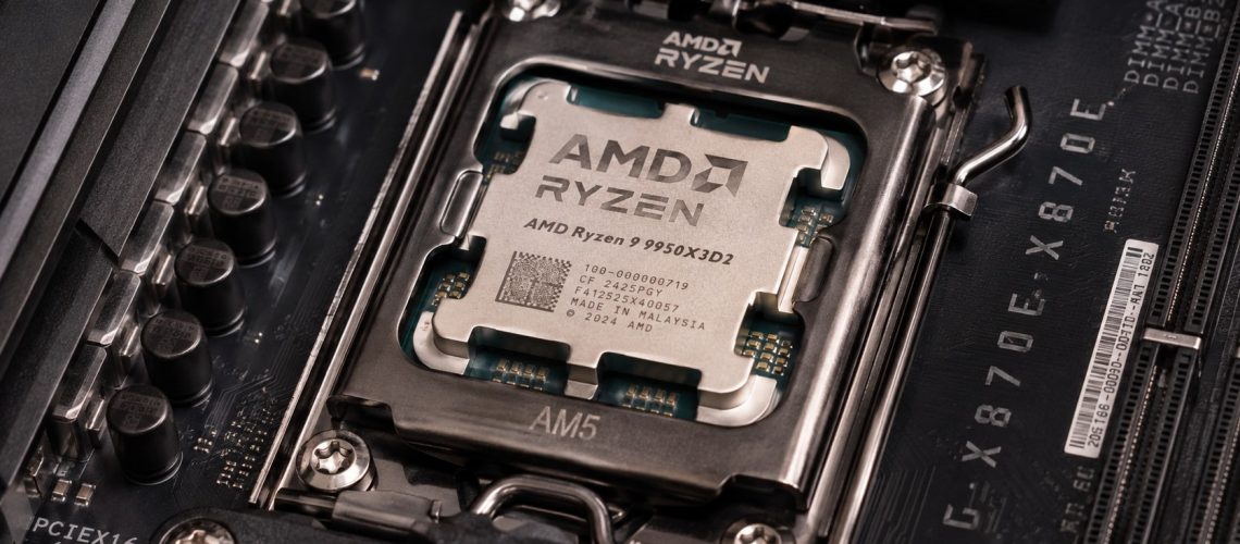 Close-up macro photograph of an AMD Ryzen 9 9950X3D2 desktop processor seated on an AM5 motherboard socket